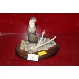 A Border Fine Arts resin figure of a standing otter by Ayres,