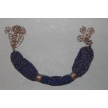A late Victorian polished steel and blue beadwork mesh purse 37 cm long