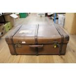 A vintage wood bound leather trunk