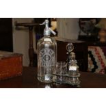 An edged soda siphon and Victorian cruet set