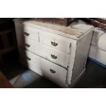 A 19th century cream painted 2 over 3 chest of drawers with brass handles,