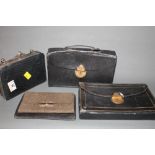 A Victorian dark blue leather travelling writing case with filled inkwell, a similar ditto (locked),