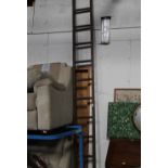 A set of vintage wooden ladders