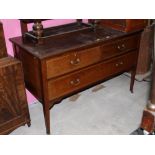 An Edwardian mahogany inlaid dressing chest with 3 drawers and raised on tapering legs of square