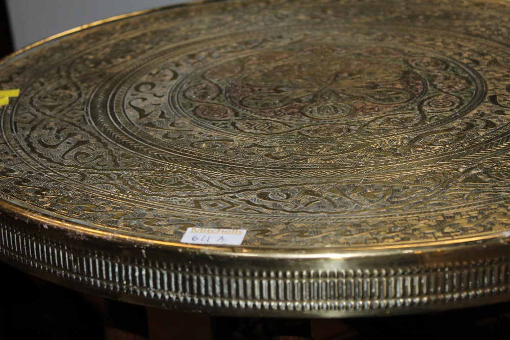 An eastern brass tray topped table - Image 2 of 2