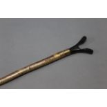 A hazel shafted walking stick with metal collar and buffalo horn thumb section. Length 124 cm.