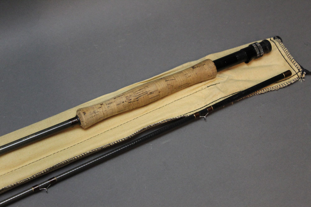 A Daiwa carbon C98 trout fly rod, in two sections, 9' 6", in two sections, 9' 6", line 6-7,