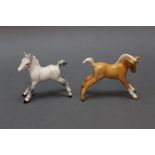 Two Beswick ponies, grey model No. 996 and Palomino model No. 815.