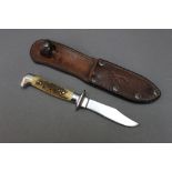 A Browning fixed blade hunting knife, in a miniature Bowie style.