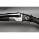 W W Greener a 12 bore side by side shotgun, with 30" barrels, cylinder and half choke,