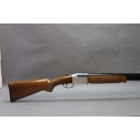 Investarm a 12 bore folding over/under shotgun, with 32" barrels, three quarter and half choke,