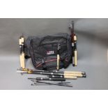 Nine travel rods and an Abu tackle bag with boxes,