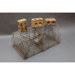 * A live Catch Rat trap together with three vintage wooden mousetraps.