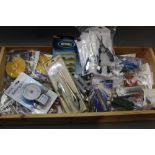 A box containing 60 fishing accessories, including weighing scales, multi tools, retrieving otters,