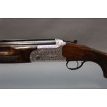 Yildiz a 12 bore over/under shotgun, with 28" multi choke barrels, comes with two chokes,