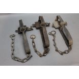 * Three vintage gin traps, one stamped Lewis.