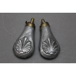 * A pair of pistol powder flasks with shell decoration, 10.5 cm.