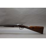 An AYA 12 bore side by side shotgun, with 28" chopper lump barrels, cylinder and improved choke,