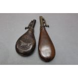 * Two leather bodied shot flasks, one embossed to both sides with a hunting dog, 18 cm and 22 cm.