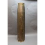 * A large brass artillery shell. Height 84.5 cm x 18.5 cm.