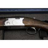 Beretta a model S685E over/under shotgun, with 27 3/4" barrels, 70 mm chambers, ejector, top lever,