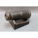 * A cast iron cannon on later stand. Length +/- 36 cm.