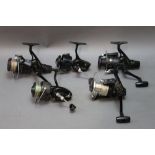 Five fixed spool reels, to include three Shimano FX4000 reels and two Mitchell reels.