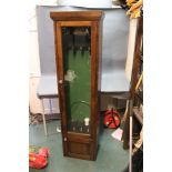 * An oak shotgun display cabinet, with space for four guns and cupboard below.