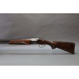 A Baikal 12 bore over under shotgun, with 28 1/2" barrels, improved and half choke, 2 3/4" chambers,