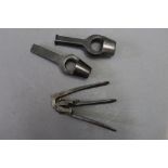 * An 8 mm Berdan capper decapper tool, together with two wad punches.