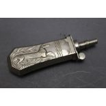 * A silver coloured pistol powder flask, decorated with a mythical beast, 10 cm.