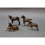 Four Beswick foals.