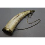 * A large powder horn with brass nozzle and hanging loop, length 31 cm.