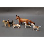 Beswick a large fox, together with three foxhounds and two terriers.