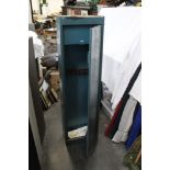 An eight gun cabinet with top locking storage box. Height 152 cm, width 43 cm, depth 23 cm.