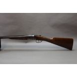 A Victor Sarasqueta 12 bore side by side shotgun, with 28" barrels, improved and quarter choke,