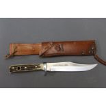 Puma an original Puma Bowie knife, stamped 6396, having a 6 1/2" blade, 28 cm overall,