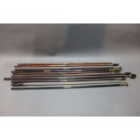 * Ten shotgun cleaning rods, various styles and lengths.