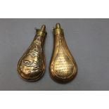 * Two copper bodied shot flasks, the first embossed with a hunting dog and deer 19 cm,