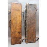 * Two leather shotgun motor cases, the first opening to a maroon baize lined interior,