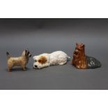 Beswick three dogs to include Cairn terrier, terrier lying and Yorkshire terrier lying.