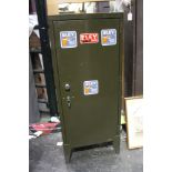* A metal locking cabinet, various Eley stickers to the front.