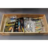 Seven tackle boxes containing a large quantity of Tobys, meps, Costers spoons,