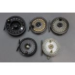 Five trout fly reels, 3 3/4" down to 3 1/8".