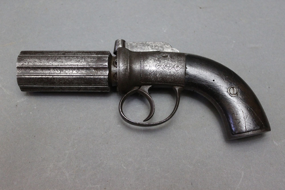 * A six shot pepperbox pistol, with 3" barrels. Overall length 21 cm.