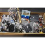 A box containing 100+ fly fishing accessories, including polarized glasses, fly boxes, priests etc.