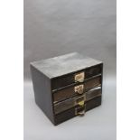 * A set of four drawers, containing various gunsmithing parts, to include air gun parts,