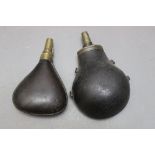 * A leather bodied powder flask, length 20 cm, together with a leather bodied shot flask,