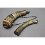 * Two horn bodied powder flasks, 23 cm and 19 cm.