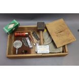 * A wooden box containing an Eley Grand Prix plastic cartridge labelled Avon Tai Winds aftershave